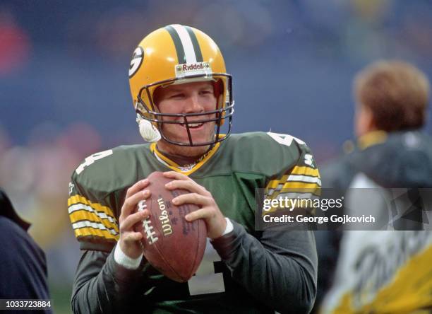 Quarterback Brett Favre of the Green Bay Packers warms up before a game against the Cleveland Browns at Cleveland Municipal Stadium on November 19,...