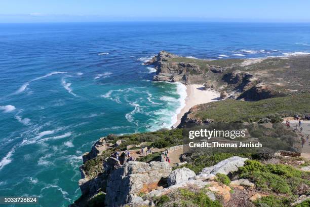 looking at the cape of good hope and dias beach from the coastal cliffs above cape point - cape point stock pictures, royalty-free photos & images