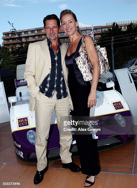 Actors Max Tidof and Lisa Seitz pose during the celebration of British sports cars manufacturer Jaguar's 75 years sporting history at the...
