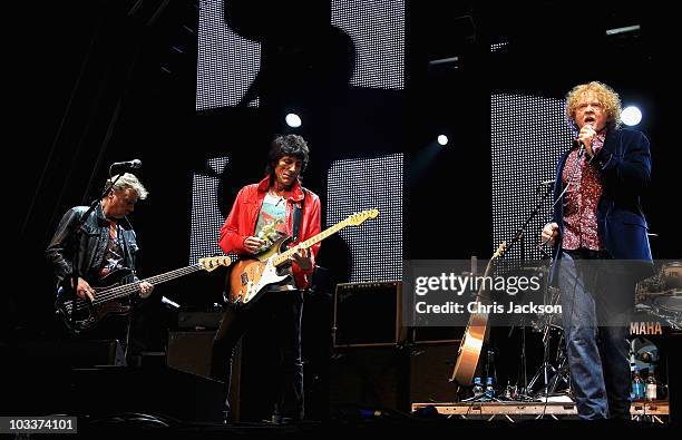 Bass guitarist Glen Matlock, guitarist Ronnie Wood and singer Mick Hucknall of the Faces perform on stage during Day 1 of the Vintage at Goodwood...