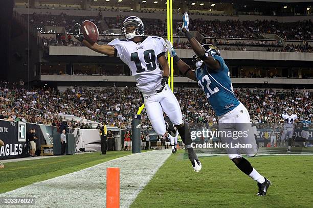 Jordan Norwood of the Philadelphia Eagles fails to hold onto a pass in the endzone under pressure from Don Carey of the Jacksonville Jaguars during...