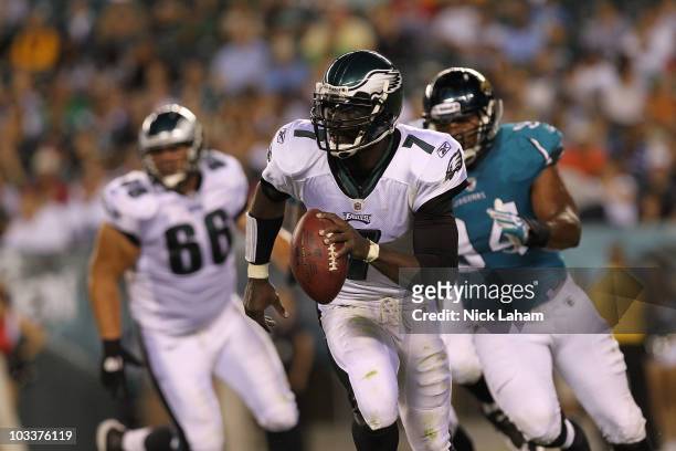 Michael Vick of the Philadelphia Eagles rolls out to pass against the Jacksonville Jaguars during their preseason game at Lincoln Financial Field on...