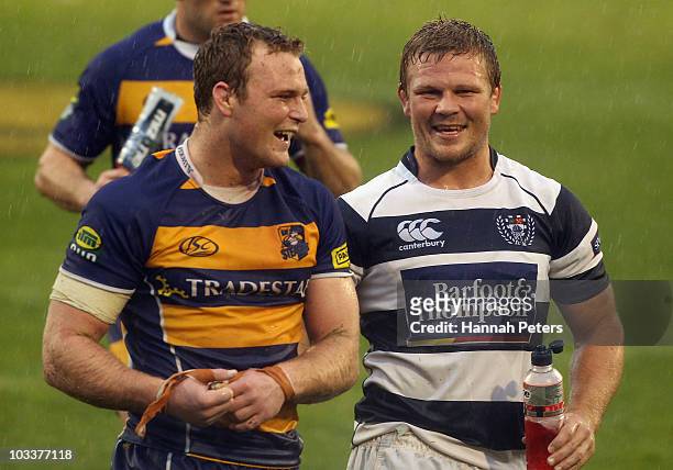 Luke Braid of the Bay of Plenty walks off the field with brother Daniel Braid of Auckland during the round three ITM Cup match between Bay Of Plenty...