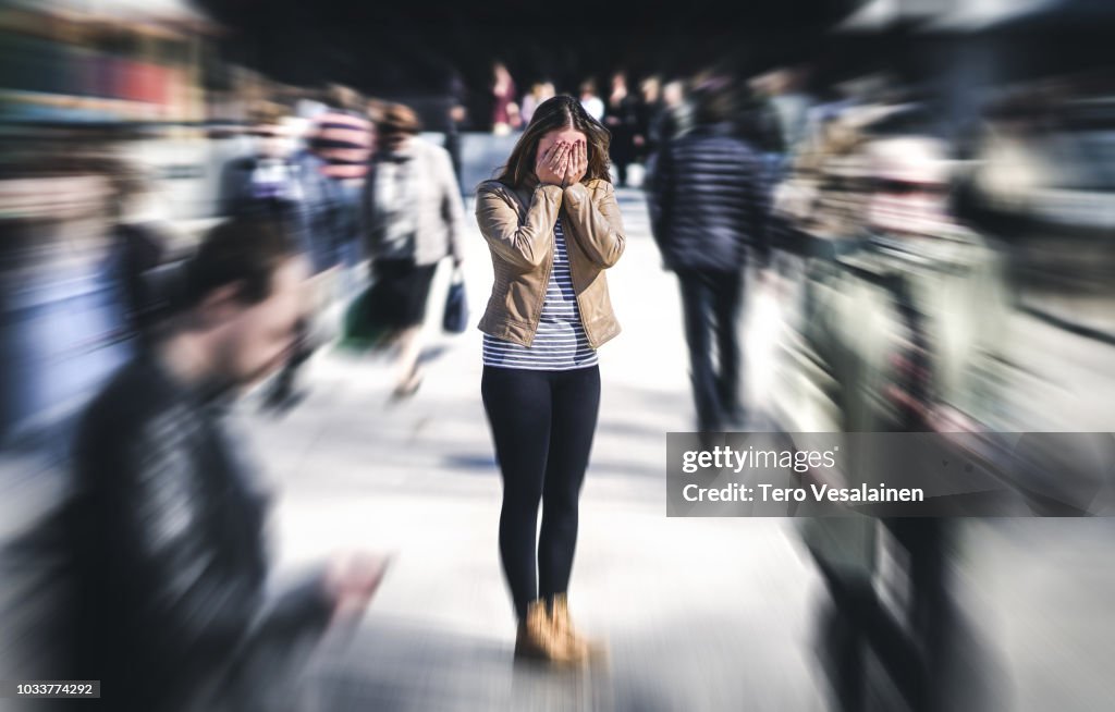 Panic attack in public place. Woman having panic disorder in city. Psychology, solitude, fear or mental health problems concept.