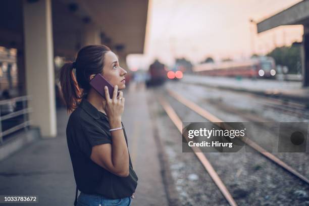woman waiting for subway train - subway station stock pictures, royalty-free photos & images