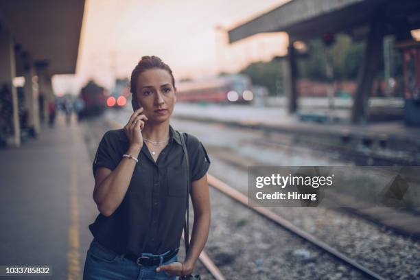 woman waiting for subway train - train denmark stock pictures, royalty-free photos & images