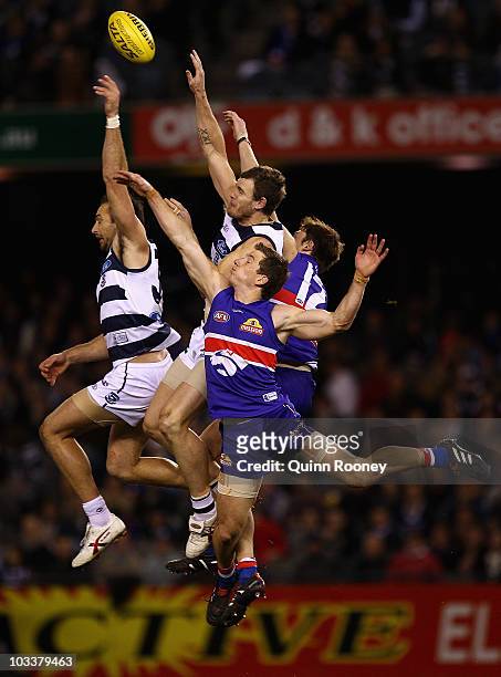 James Podsiadly and Cameron Mooney of the Cats attempt to mark during the round 20 AFL match between the Western Bulldogs and the Geelong Cats at...