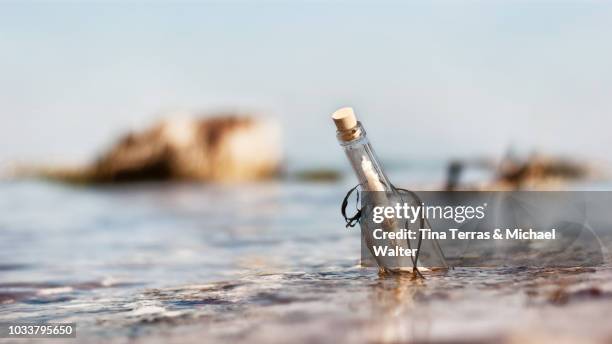 message in a bottle from a police officer named sting - message in a bottle stock pictures, royalty-free photos & images