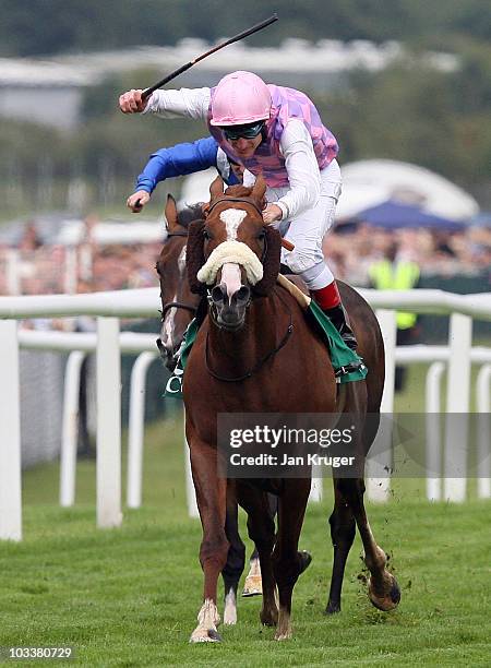 Sans Frontieres ridden by jockey Johnny Murtagh leads to win the Cga Geoffrey Freer Stakes at Newbury racecourse on August 14, 2010 in Newbury,...