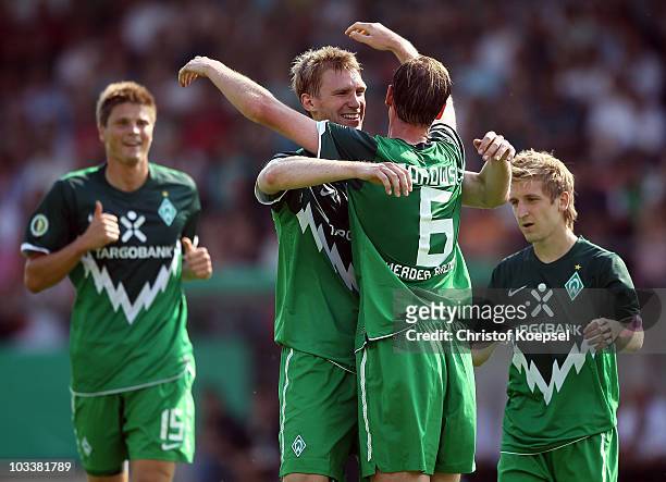 Tim Borowski of Bremen celebrates the third goal with Per Mertesacker during the DFB Cup first round match between Rot Weiss Ahlen and SV Werder...