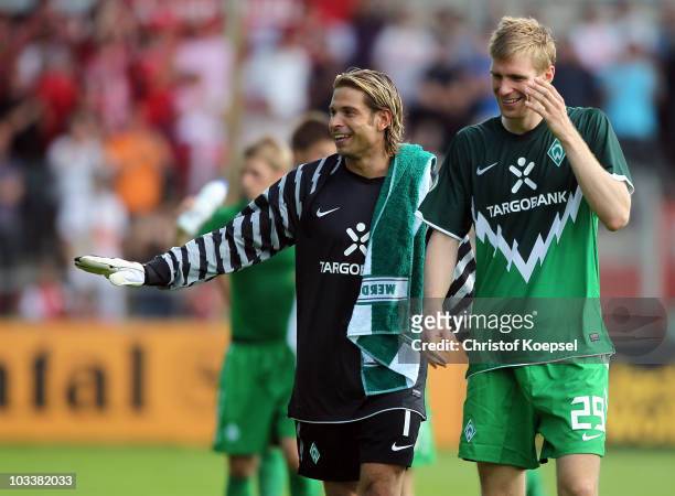 Tim Wiese and Per Mertesacker of Bremen celebrate the 4-0 victory after the DFB Cup first round match between Rot Weiss Ahlen and SV Werder Bremen at...