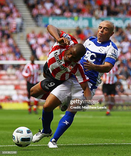 Stephen Carr of Birmingham tackles Fraizer Campbell of Sunderland to give a way a penalty during the Barclays Premier League match between Sunderland...