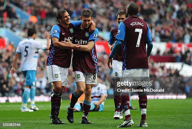 James Milner of Aston Villa celebrates his goal with Marc Albrighton during the Barclays Premier League match between Aston Villa and West Ham United...