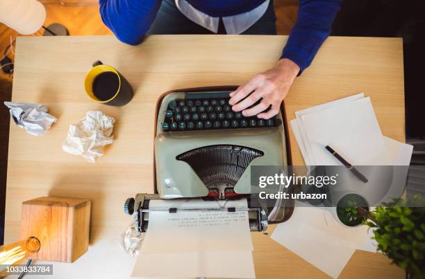 hipster writer working on typewriter - entertainment book edit stock pictures, royalty-free photos & images