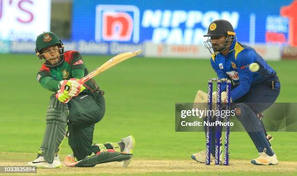 Bangladesh cricketer Mushfiqur Rahim plays a shot during the first cricket match of Asia Cup 2018 between Sri Lanka and Bangladesh in Dubai, United...