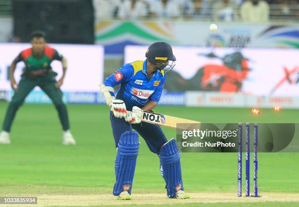 Sri Lankan cricketer Upul Tharanga is bowled out during the first cricket match of Asia Cup 2018 between Sri Lanka and Bangladesh in Dubai, United...