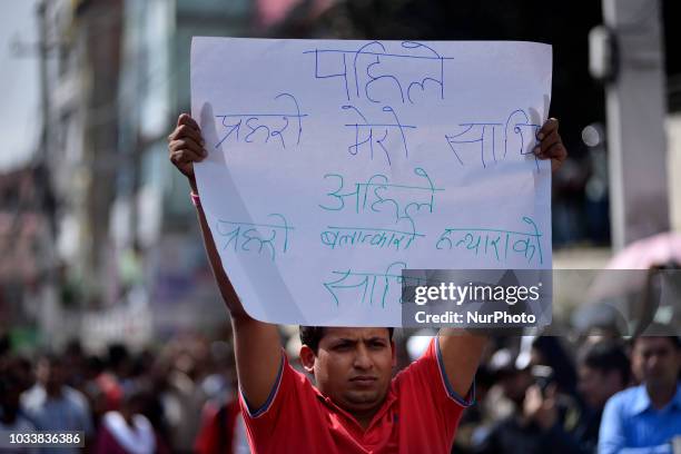 Nepalese youth hold placards and chants slogans in the mass rally of 13yrs old Nirmala Panta, who was raped and murdered 50 days ago in Kanchanpur...