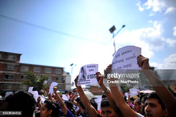 Nepalese people holds placards and chants slogans in the mass rally of 13yrs old Nirmala Panta, who was raped and murdered 50 days ago in Kanchanpur...