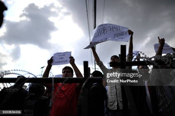 Nepalese people holds placards and chants slogans in the mass rally of 13yrs old Nirmala Panta, who was raped and murdered 50 days ago in Kanchanpur...