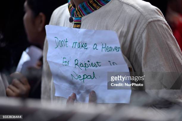 Nepalese youth hold placards and chants slogans in the mass rally of 13yrs old Nirmala Panta, who was raped and murdered 50 days ago in Kanchanpur...