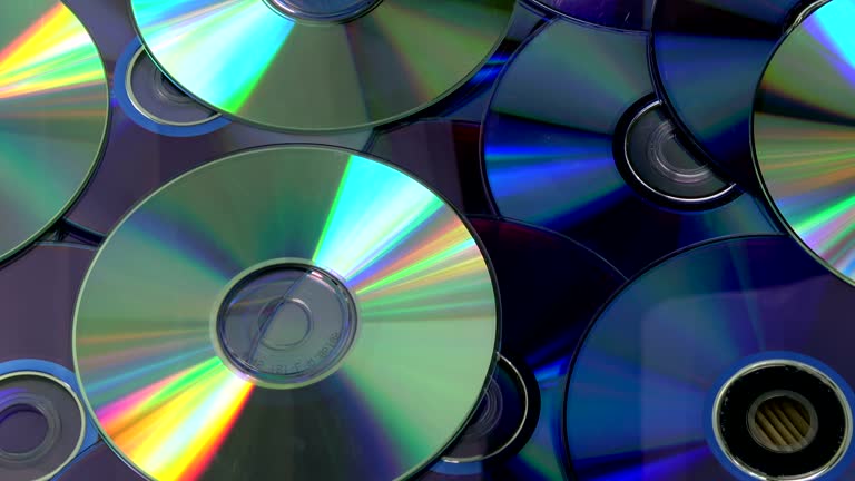 Rotating shiny DVD and CD compact discs background 동영상 (1033843034 ...