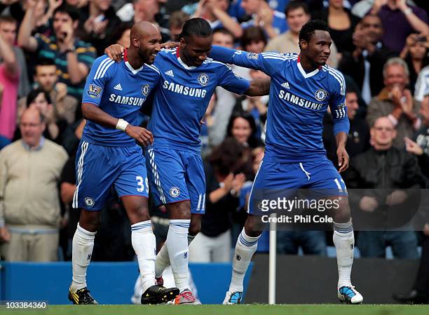Didier Drogba of Chelsea is congratulated by teammates Nicolas Anelka and John Obi Mikel after scoring his team's third goal during the Barclays...