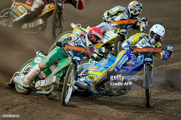 Tomas Jonasson from Sweden and Tomasz Gollob of Poland, compete during the FIM Speedway Grand Prix of Sweden, at the speedway stadium in Malilla, on...