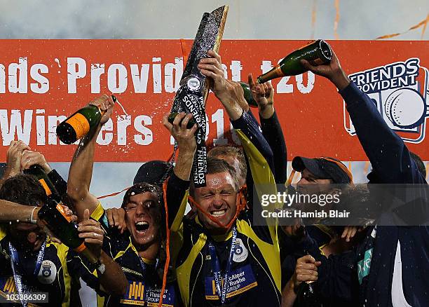 Dominic Cork of Hampshire celebrates with the trophy and team mates after the Friends Provident T20 Final between Hampshire Royals and Somerset at...