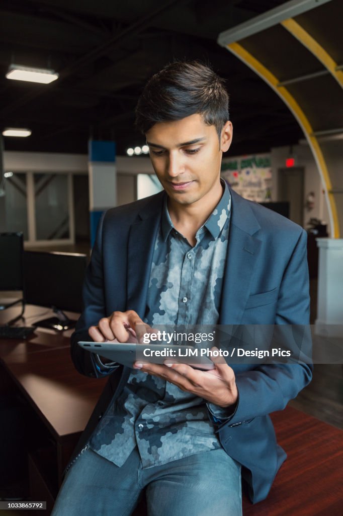 Millenial Using Technology Young Millennial Businessman Using His Technology In The Workplace High ...