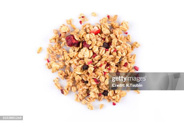 muesli cereals close up with  raisins, oat and wheat flakes, fruits, strawberry, cranberry, cherry pieces. isolated on white - muesli bildbanksfoton och bilder