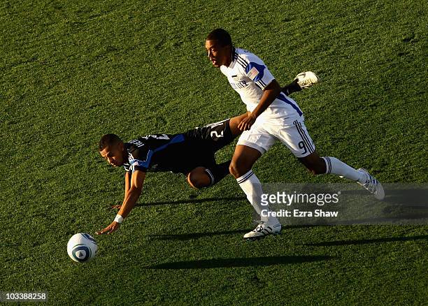 Teal Bunbury of the Kansas City Wizards and Jason Hernandez of the San Jose Earthquakes go for the ball at Buck Shaw Stadium on August 14, 2010 in...