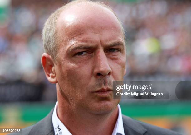 Mario Basler, head coach of Wacker Burghausen, looks on during the DFB Cup first round match between Wacker Burghausen and Borussia Dortmund at...