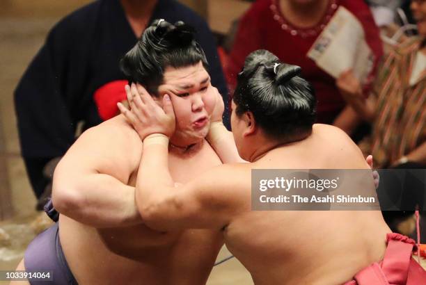 Onosho and Abi compete on day seven of the Grand Sumo Autumn Tournament at Ryogoku Kokugikan on September 15, 2018 in Tokyo, Japan.