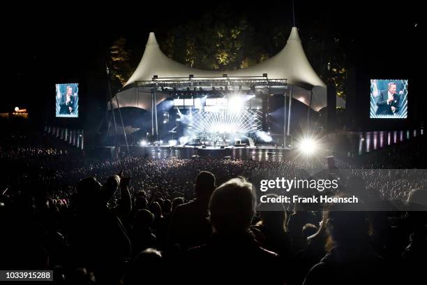 German singer Roland Kaiser performs live on stage during a concert at the Waldbuehne on September 15, 2018 in Berlin, Germany.