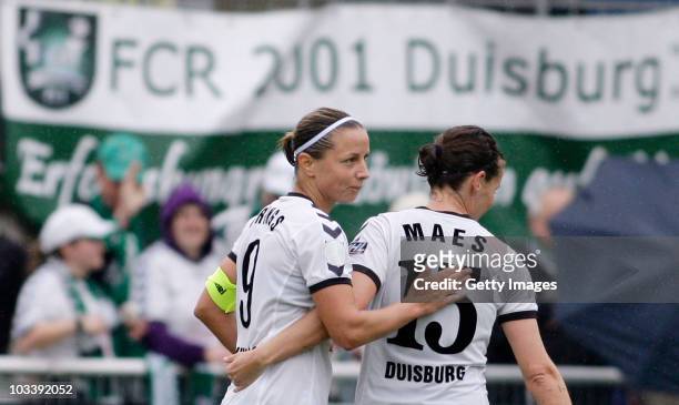 Inka Grings and Femke Maes of Duisburg celebrate a goal during the Women's Bundesliga match between FCR 2001Duisburg and Bayer 04 Leverkusen at the...