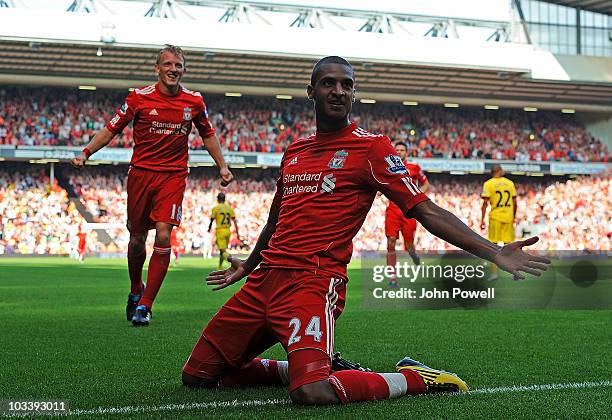 David Ngog of Liverpool celebrates after scoring the opening goal during the Barclays Premier League match between Liverpool and Arsenal at Anfield...