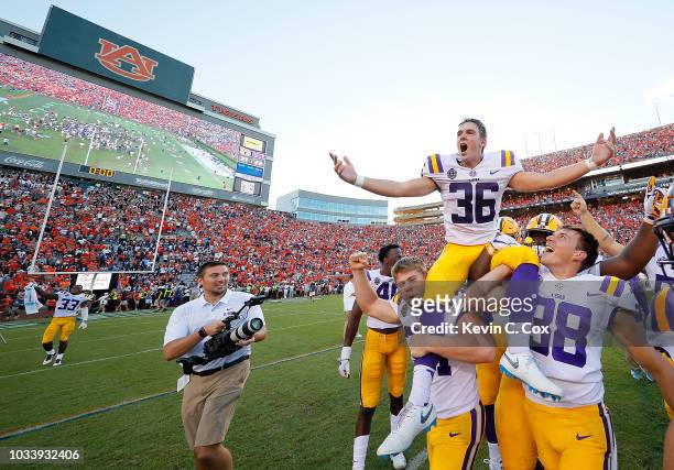 Cole Tracy of the LSU Tigers celebrates after kicking the game-winning field goal in their 22-21 win over the Auburn Tigers at Jordan-Hare Stadium on...
