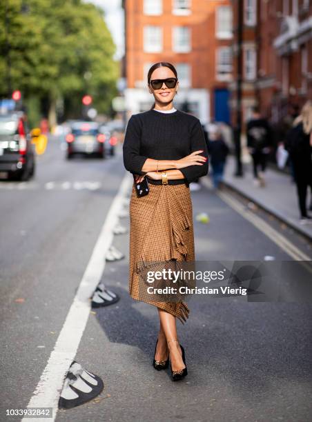 Evangelie Smyrniotaki wearing brown skirt is seen outside JW Anderson during London Fashion Week September 2018 on September 15, 2018 in London,...