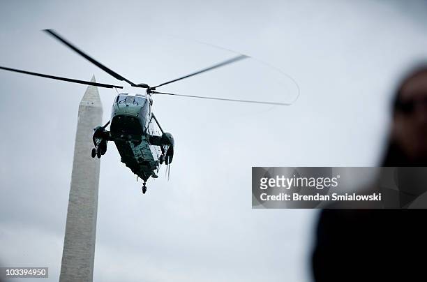 Marine One with President Barack Obama, first lady Michelle Obama and their daughter Sasha approaches the South Lawn of the White House August 15,...