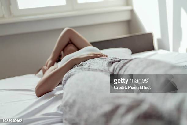 some mornings are a struggle to get out of bed - pms stock pictures, royalty-free photos & images