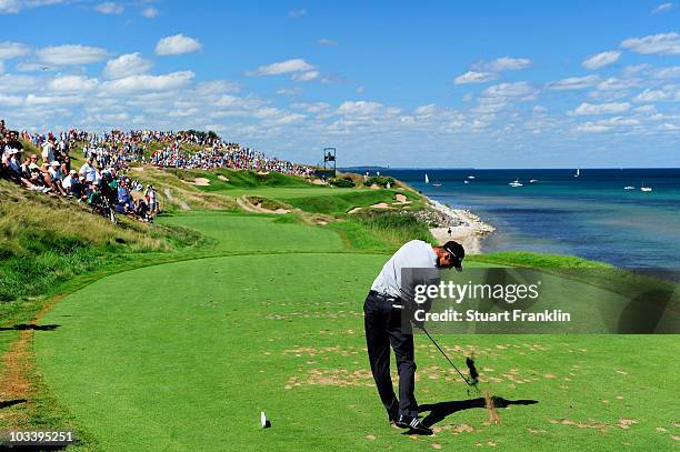 Martin Kaymer of Germany hits his tee shot on the seventh hole during the final round of the 92nd PGA Championship on the Straits Course at Whistling...