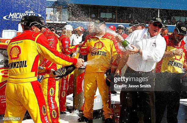 Kevin Harvick , driver of the Shell / Pennzoil Chevrolet, celebrates with team owner Richard Childress in victory lane after winning the NASCAR...
