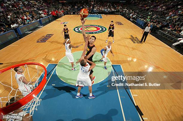 Yi Jianlian of China shoots against Ricardo Sanchez of Puerto Rico at Madison Square Garden on August 15, 2010 in New York City. NOTE TO USER: User...