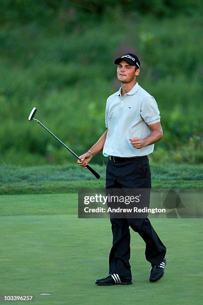 Martin Kaymer of Germany celebrates on the 18th green after defeating Bubba Watson during the three-hole aggregate playoff following the final round...