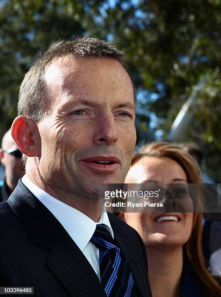Opposition leader Tony Abbott and Fiona Scott, Liberal candidate for Lindsay, speak to the media during the Australian Liberal Party's final week of...