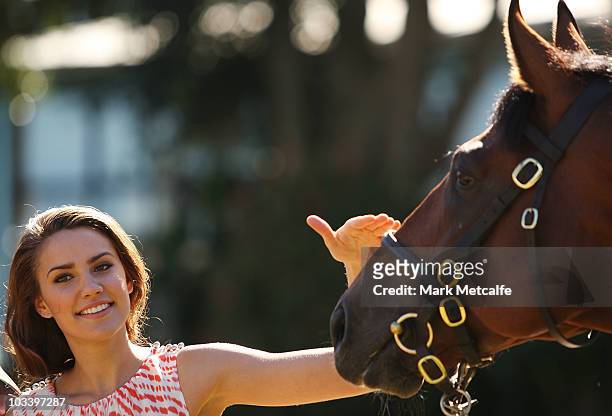 Rachael Finch poses with Big Brown at a media conference announcing the arrival of world champion racehorse Big Brown at the Inglis Stables on August...