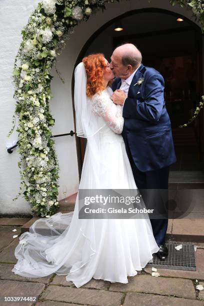 Bride Laura Kaefer and her husband bridegroom Ralph Siegel during the church wedding of Ralph Siegel and Laura Kaefer at the protestant church...