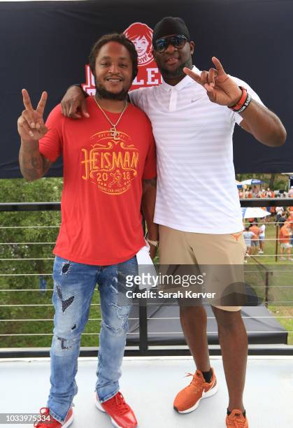 Vince Young, Heisman Trophy winner and Texas Longhorn legend, and LenDale White, former American football running back, stopped by the Wendy's...