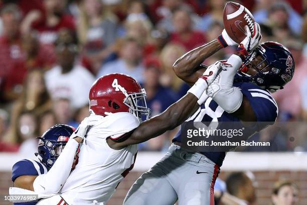 Moore of the Mississippi Rebels intercepts the ball over Jerry Jeudy of the Alabama Crimson Tide during the second half of a game at Vaught-Hemingway...