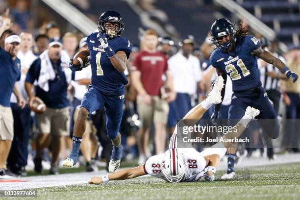 Maurice Alexander of the Florida International Panthers runs down the sideline to score a third quarter touchdown against the UMass Minutemen at FIU...